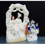 A Staffordshire flat back Queen Victorian and Prince Albert figure group, together with a Poor