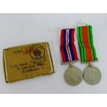 Two WWII medals to include Defence and 1939 - 1945 War Medal (2)