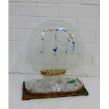 A Victorian Nailsea glass dome with sailing ship, (dome fixed to the base) overall height 40cm