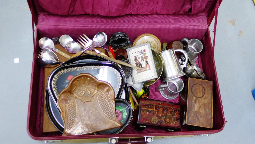 A vintage suitcase containing copper crumb tray, leather gloves, tea caddy etc., (a lot)