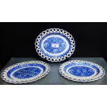 A pair of pearl ware blue and white 'Pagoda' patterned oval stands with reticulated rims, together