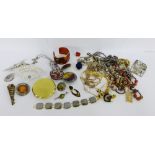 A collection of costume jewellery to include brooches, pendants and beads etc (a lot)