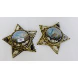 A pair of star shaped shell frames containing prints of boats, 35cm long, (2)