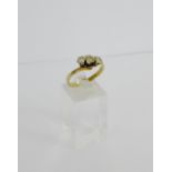 A 9 carat gold three stone diamond dress ring, UK ring size S