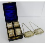 A set of four Epns napkin rings in a fitted box together with two Epns decanter labels to include