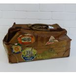 A vintage brown leather travel case with various labels, 58cm long