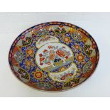 A large Japanese Meiji Imari charger with Chrysanthemums and foliage, complete with a black