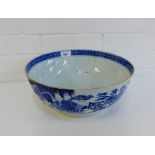 A Chinese blue and white punch bowl painted with a garden landscape (repaired with staples), 33cm