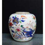 A Chinese Famille Rose ginger jar painted with Peacock, flowers and foliage, lid lacking, 22cm high