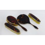 A Birmingham silver and tortoiseshell four piece dressing table set compromising hair brush,
