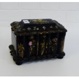 A black lacquered mother-of-pearl and abalone inlaid tea caddy, the hinged lid opening to reveal