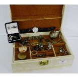 A jewellery box containing a collection of costume jewellery to include chains, brooches earrings