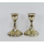 A pair of George V silver desk candlesticks on circular Greek Key engraved footrim, with makers mark