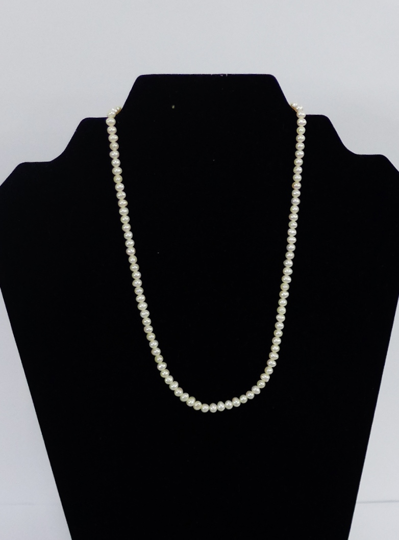 A strand of pearls with a 9 carat gold clasp fitting