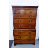 A Georgian mahogany chest on chest, the cornice top over two short and three long drawers, with a