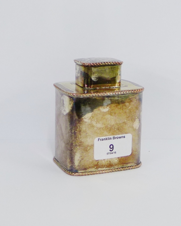 A silver plate on copper tea caddy and cover with gadrooned rims, 11cm high