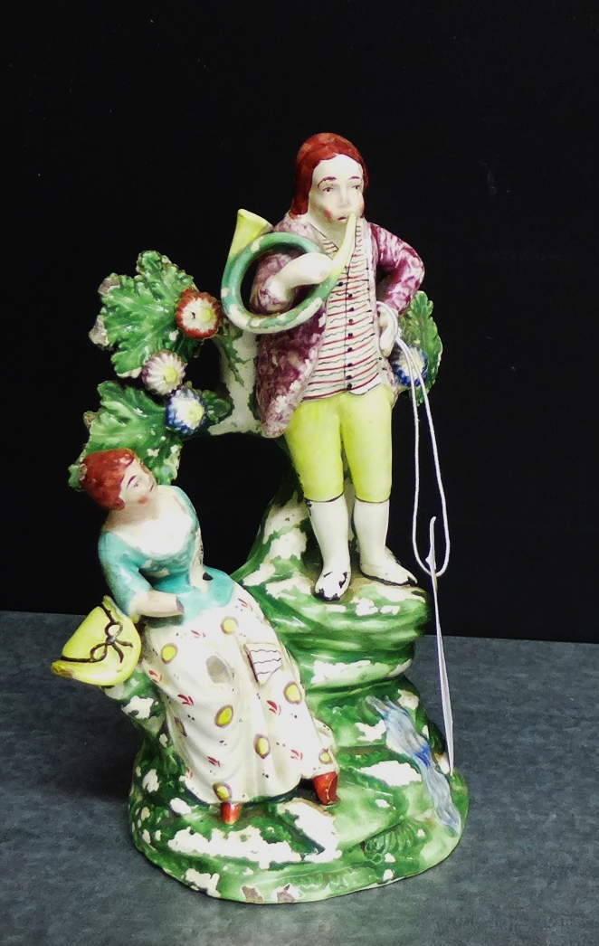 A Staffordshire pottery male and female figure group, (a/f), 20cm high