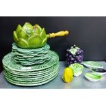 A quantity of green glazed leaf moulded tables wares to include dinner plates, bowls, side plates,