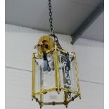 A brass and glass panelled hall lantern light