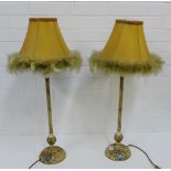 A pair of knop stemmed metal table lamps painted with flowers, complete with feather edged shades,