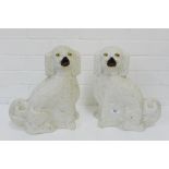 A pair of white glazed Staffordshire chimney spaniels, 35cm high, (2)