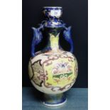 A Japanese earthenware twin handled vase painted with stylised motifs, 37cm high