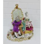 A continental porcelain figure group of an 'Artist and his Sitter' on a Rococo style base, overall