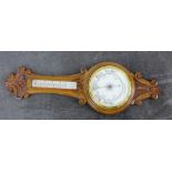 A carved oak wall barometer, 90cm