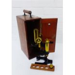 A mahogany cased brass lacquered W. Watson & Sons Praxis Petro microscope