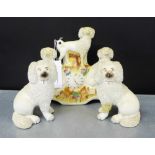 A pair of Staffordshire white glazed seated spaniels, together with a clock and sheep flatback, (