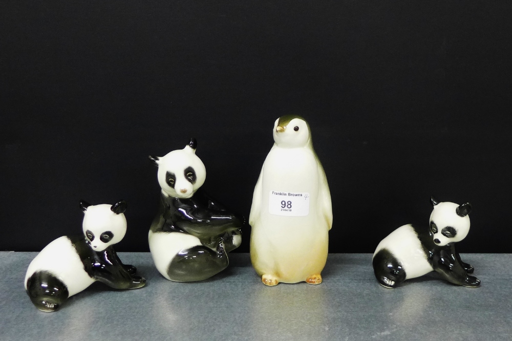 A group of three Russian porcelain Panda Bear figures, together with a Russian pottery Penguin