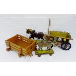 A collection of vintage wooden painted toys to include pull-a-long horses and carts, (4)