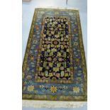 20An Eastern rug, the blue field with all over foliate design, 125 x 230cm