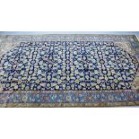 An Eastern rug, the blue field with all over foliate design, 400 x 200cm