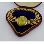 A 9 carat gold cased lady's wristwatch on an unmarked yellow gold bracelet strap with fancy links,