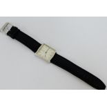Milus a Gents wristwatch on black leather strap