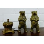 A collection of brass money banks to include two standing bear figures and a crown, (3)