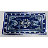 Chinese style small carpet commissioned by Ma Hushan (1910 - 1954) circa 1930, the blue ground