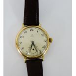 A Gent's Omega wristwatch, the large champagne dial with Arabic numerals and subsidiary seconds