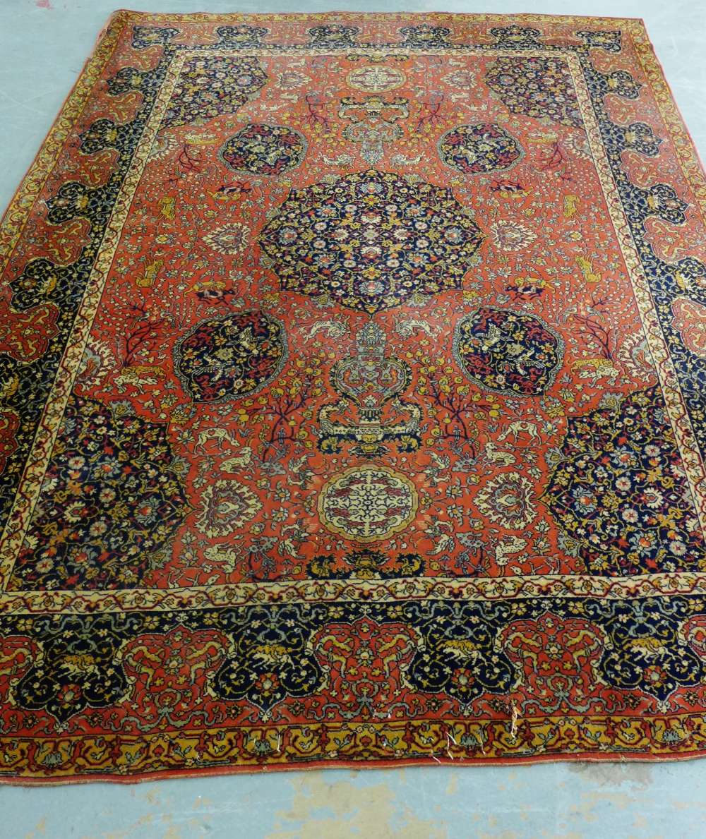 An Eastern rug, the red field with allover flowers and animals pattern, 368 x 270cm