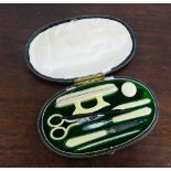 An early 20th century ivory manicure set in a fitted case