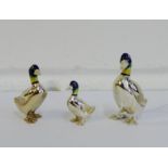 A group of three silver plated and enamelled duck figures in graduating size, tallest 5cm (3)