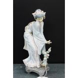 A Lladro porcelain figure of a Japanese lady, modelled standing with a Bonsai tree at her feet, 25cm