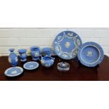 A collection of Wedgwood blue and white Jasper ware to include plates, vases, jug etc., (9)