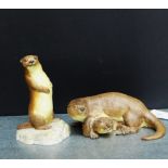 An Aynsley porcelain Otter family group, together with another, both modelled by John Aynsley,