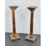 A pair of wooden pedestal columns with ionic capitals and dentil frieze , 98 x 32cm, (2)