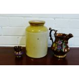 A stoneware crock and two copper lustre jugs, (3)