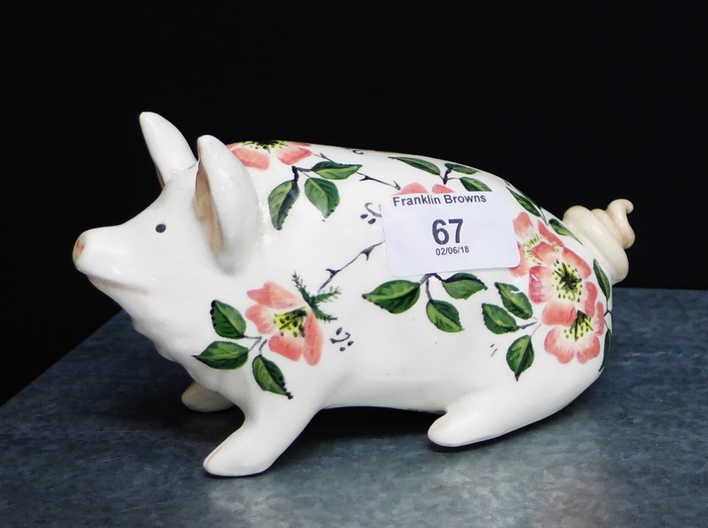 A Griselda Hill pottery Wemyss ware pig, painted with flowers, 17cm long