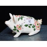 A Griselda Hill pottery Wemyss ware pig, painted with flowers, 17cm long