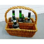 Four bottles of Harvey's Bristol Cream, together with another smaller contained in a wicker